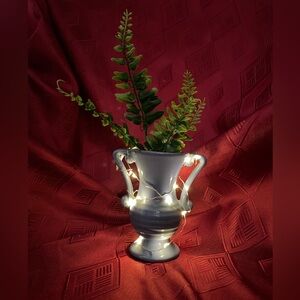 Two handled blue mini-vase with fairy lights and artificial greenery accent